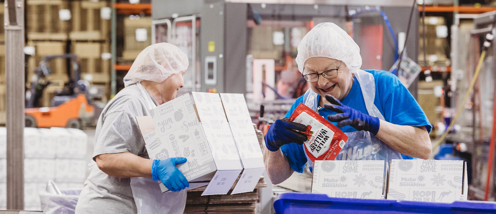workers at Kenny's Candy packaging cases of licorice